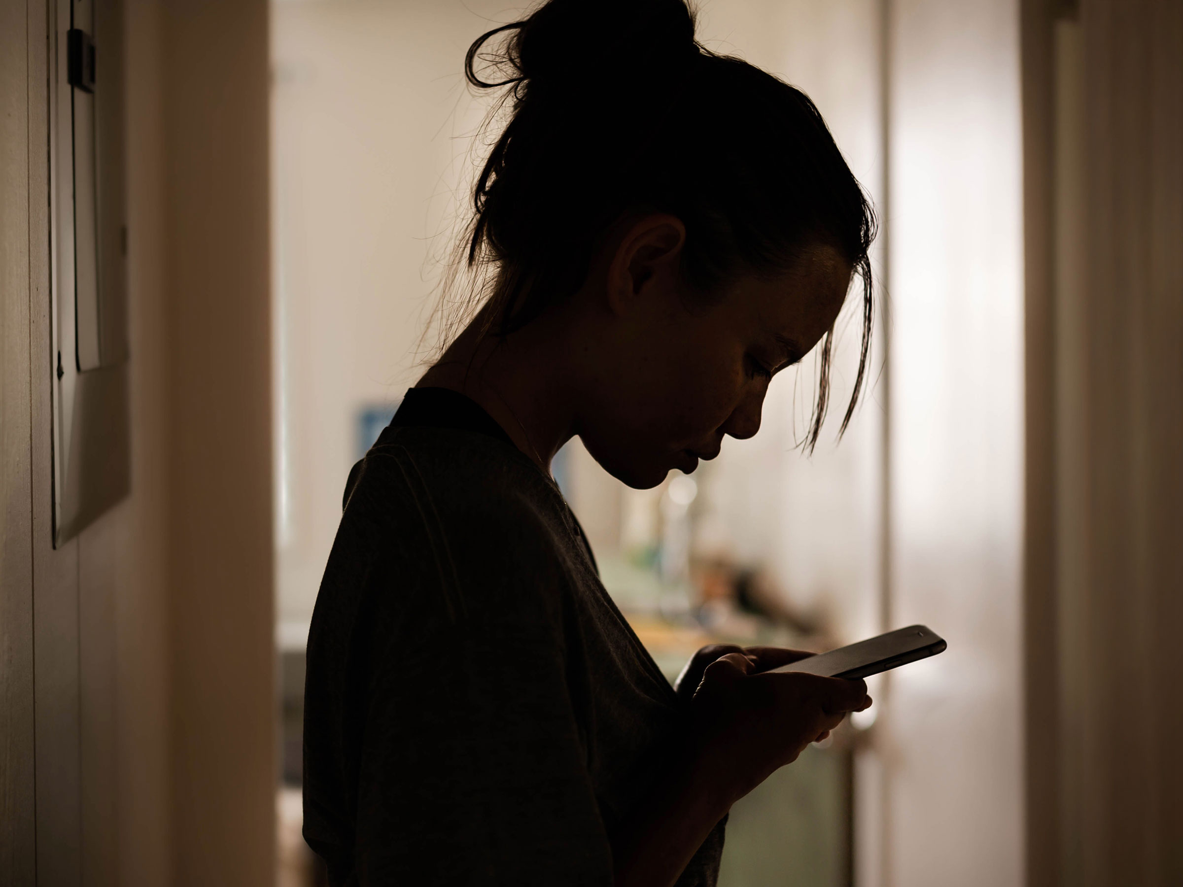 A young woman looking at her phone